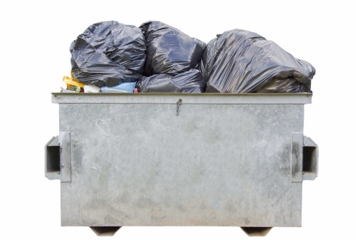 Person browsing the Rubbish Removal Putney website on a laptop